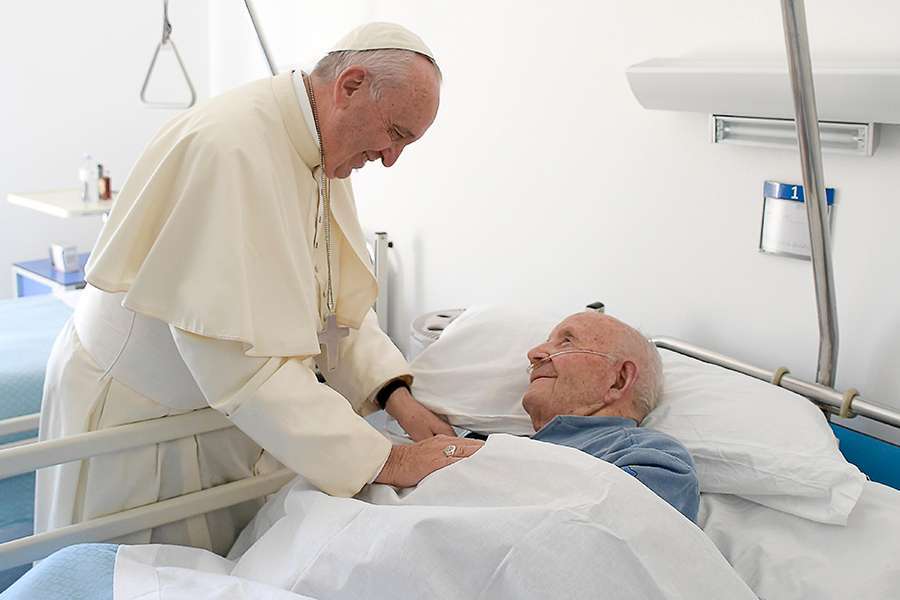 Priest administering Anointing of the Sick